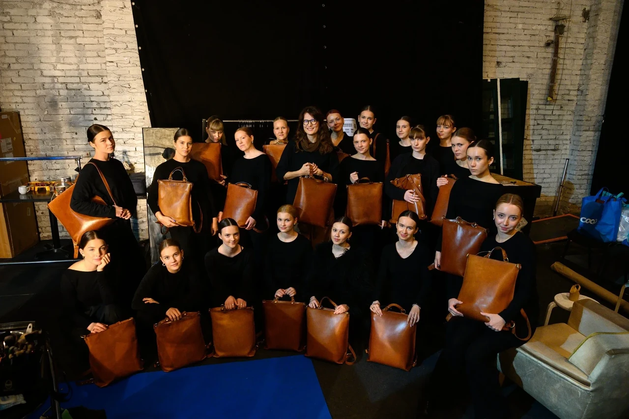 The performers backstage each holding a light brown Mild Librarian