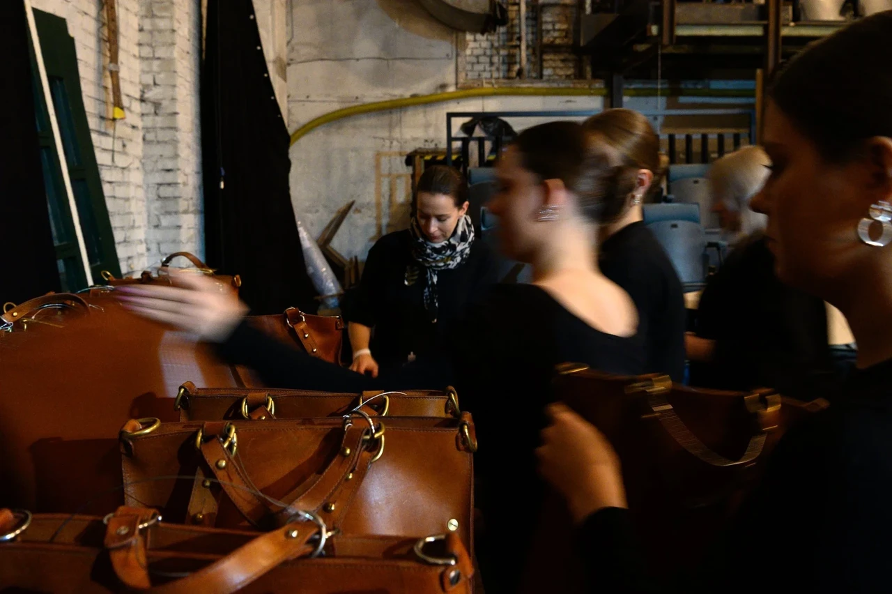 Backpacks and performers before the show