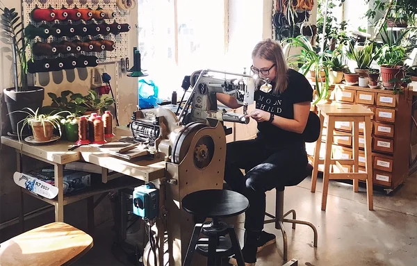 Maker Kerli at the sewing machine in the Stella Soomlais leather workshop